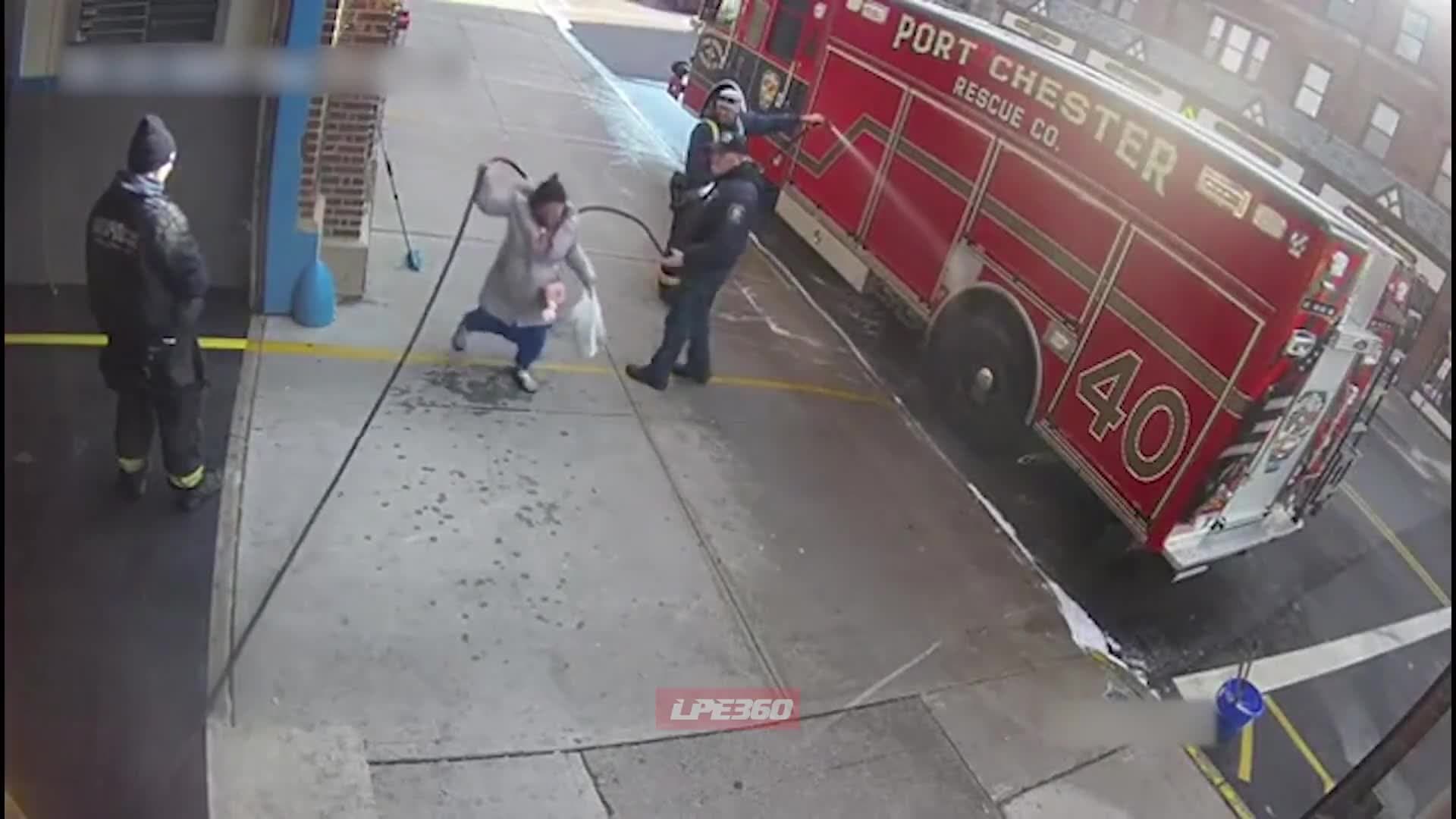 Video thumbnail for Woman walks under fire hose instead of over it