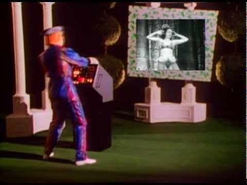 YouTube thumbnail for Devo - "Beautiful World" - YouTube