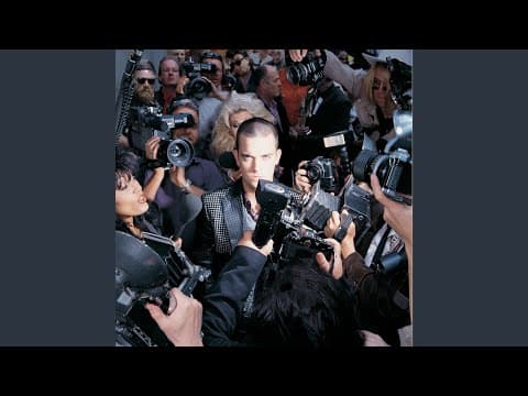 YouTube thumbnail for Song of the Day: Ego Agogo by Robbie Williams