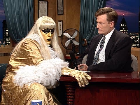 YouTube thumbnail for Conan welcomes Goldust to the show. Things get weird... (1996)