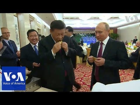 YouTube thumbnail for Xi Jingpig and Vladamir Putin making dumplings