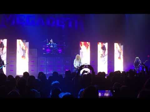 YouTube thumbnail for Fan jumps on stage and steals pick from Dave Mustaine