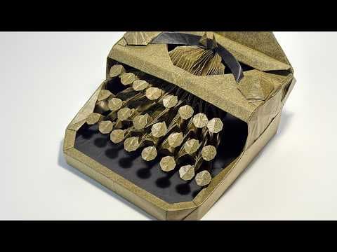 YouTube thumbnail for "I tried folding a mechanical typewriter using a single sheet of uncut 124cm paper."